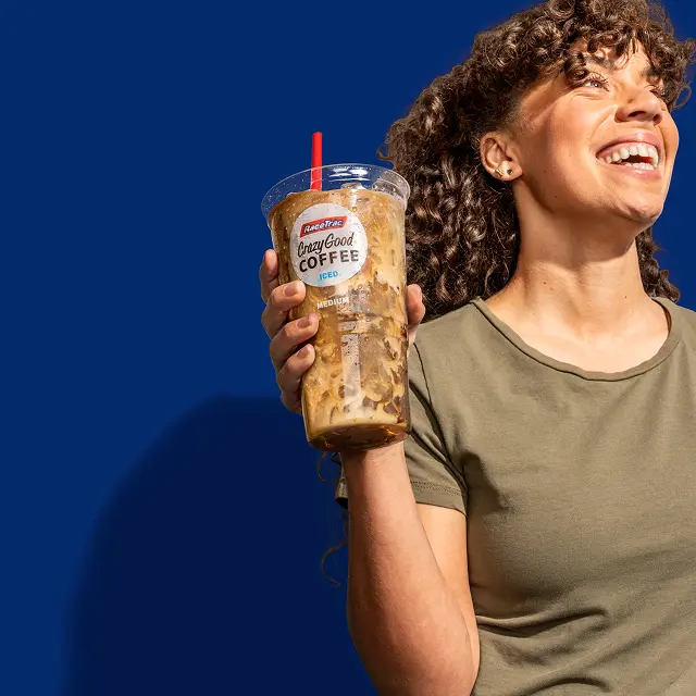 Woman holding a RaceTrac iced coffee
